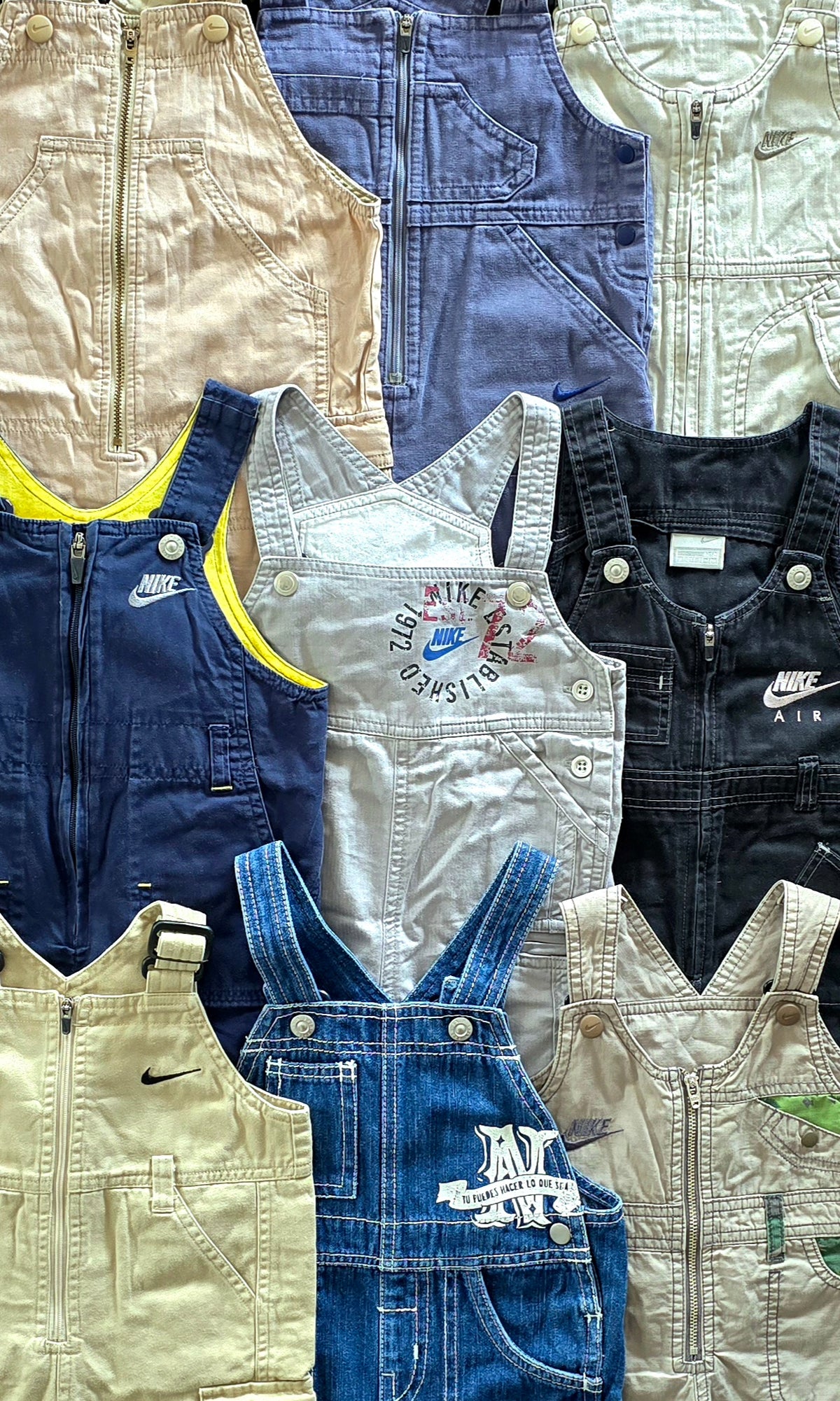 Collection of various overalls with different designs and colors.